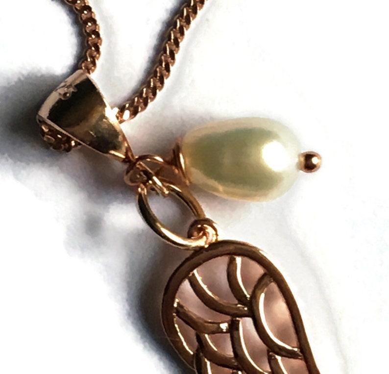 Angel wing and pearl pendant