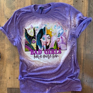May include: Purple t-shirt with a bleach-splattered design featuring the faces of four Disney villains. The text "Bad Girls have more fun" is printed below the images.
