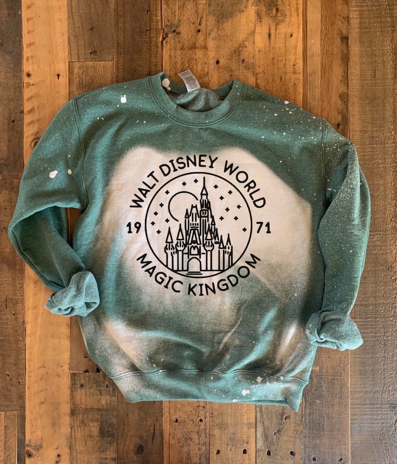 Magic kingdom sweatshirt with bleached washed forest green material. Soft, thick forest sweatshirt.