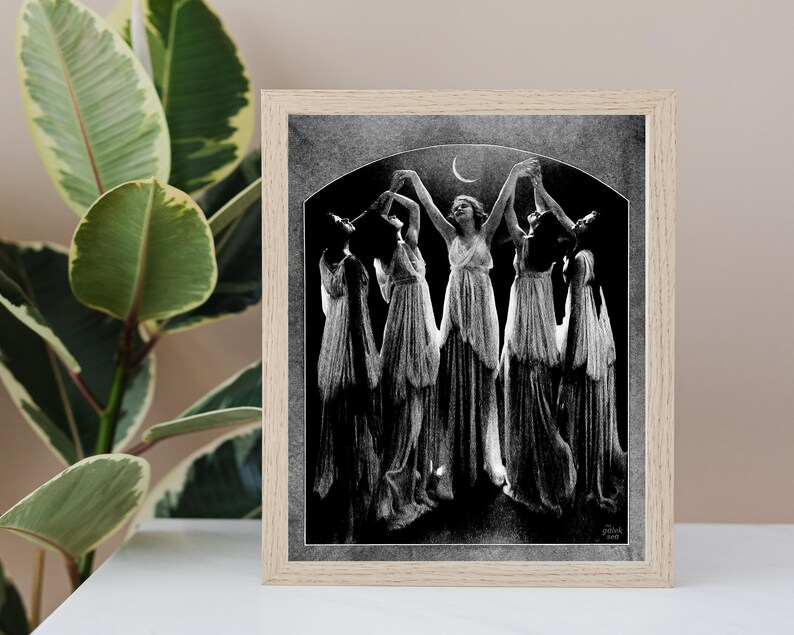 May include: Black and white illustration of a group of women in flowing robes dancing under a crescent moon. The women are holding hands and appear to be in a trance-like state.