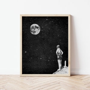 May include: A black and white photo of a person standing on a cliff, looking up at a full moon in a starry night sky.
