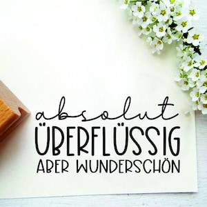Stempeltext "Absolut überflüssig aber wunderschön"