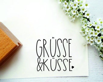 small stamp "greetings and kisses" for gift labels, gifts, cards, packaging