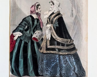 May include: An antique fashion illustration featuring two women in elaborate dresses. One wears a striped teal and black gown with a pink head covering, the other a black cape with fur trim over a blue patterned dress. The text at the bottom reads "Godey's Unrivalled Colored Fashions."
