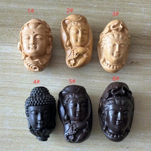 May include: Six wooden carvings of Buddhist deities, each with a different expression and pose. The carvings are in two colors: light brown and dark brown.