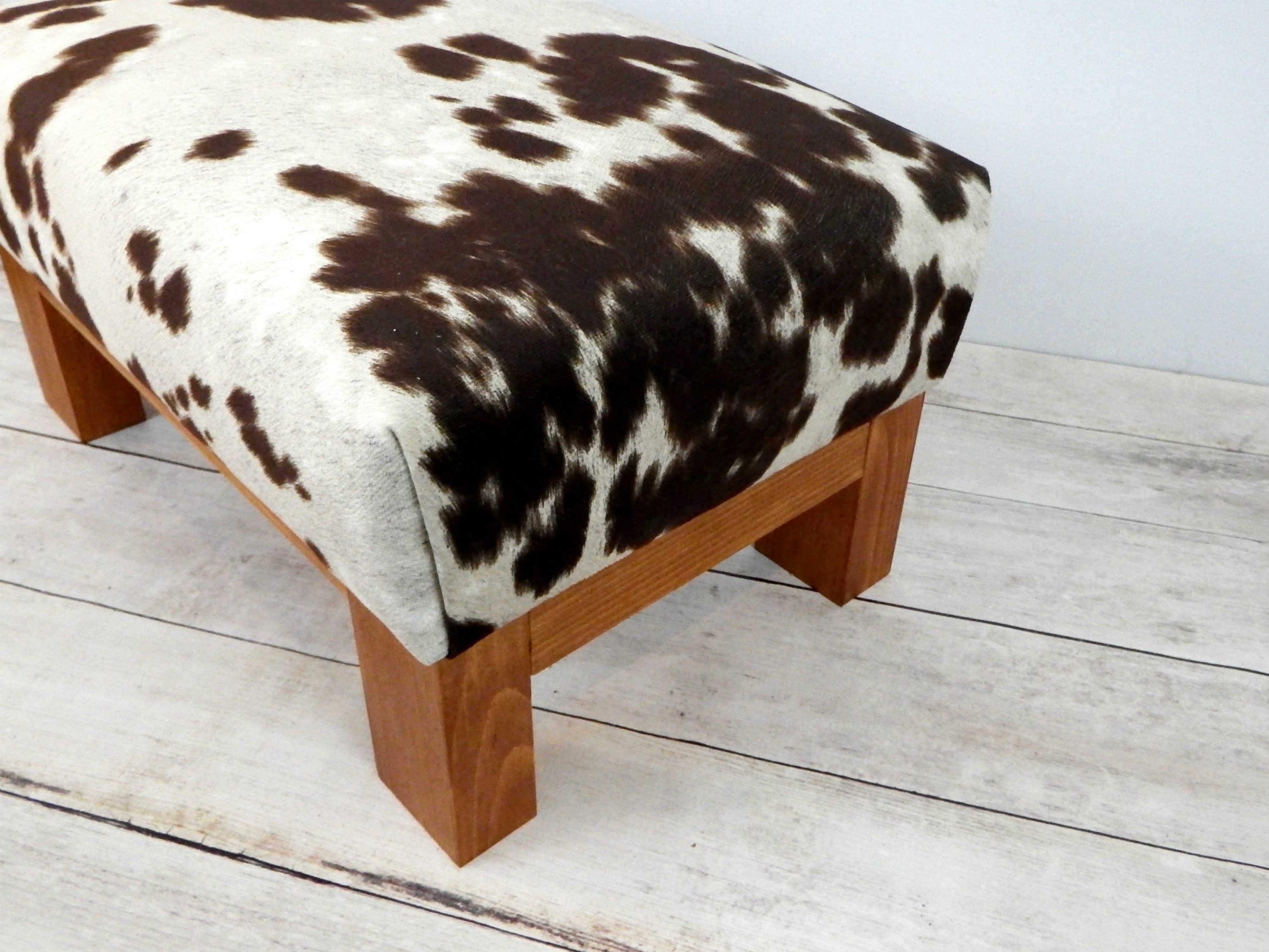 Faux cowhide ottoman cow hide print upholstered ottoman Etsy