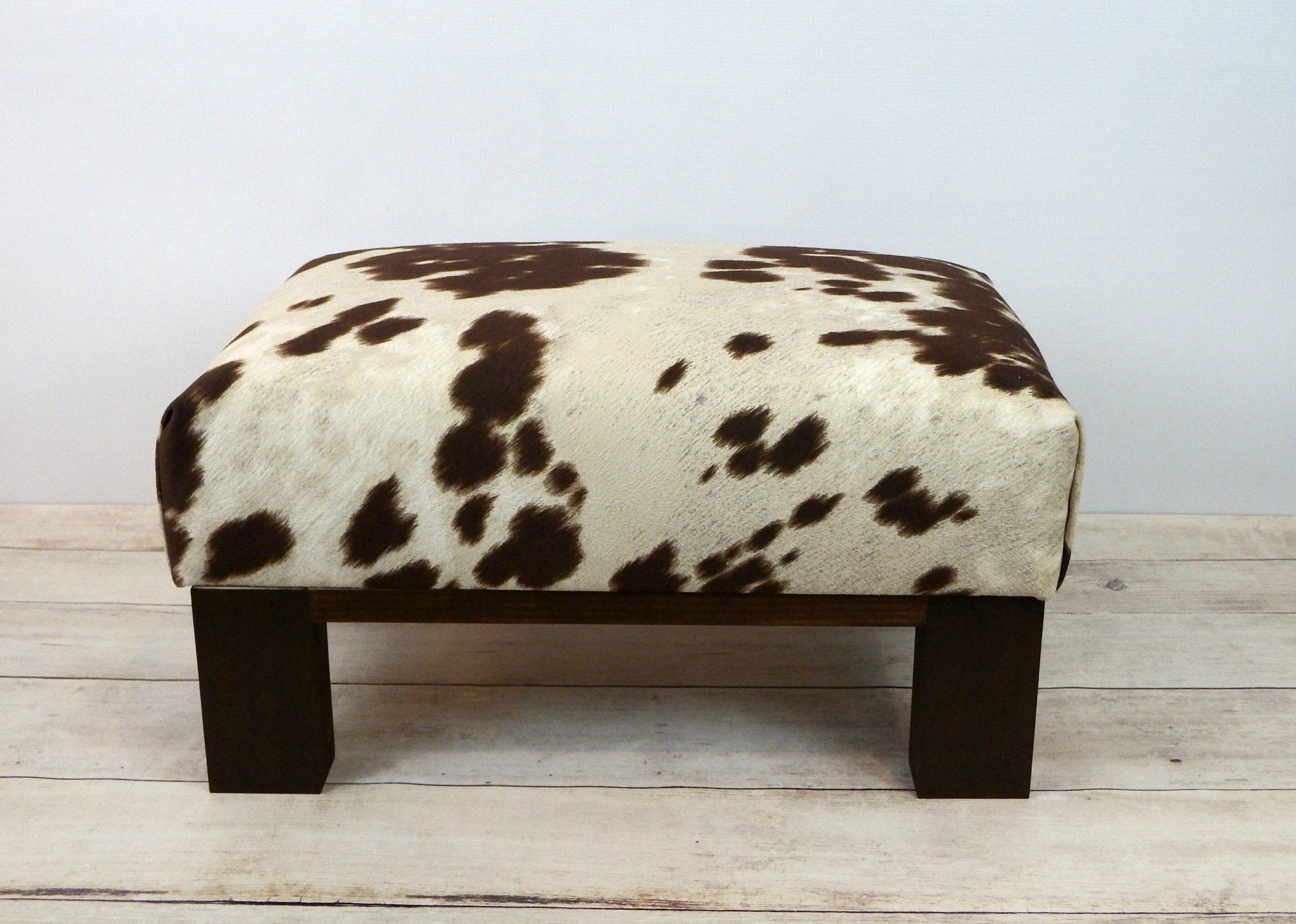 Faux cowhide ottoman cow hide print upholstered ottoman Etsy