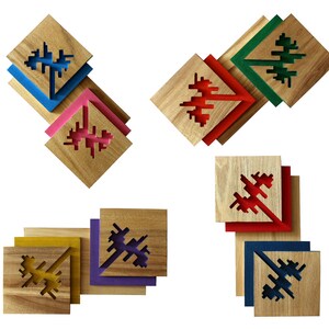 May include: Four sets of wooden coasters with a geometric design. Each set has four coasters in different colors: blue, pink, green, purple, red, yellow, and navy blue.