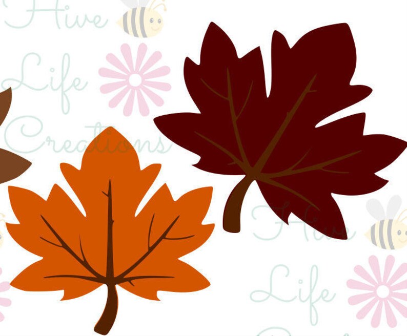 May include: Two autumn leaves, one orange and one brown, are shown against a white background with pink flowers and bees.