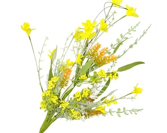 May include: A vibrant bouquet of artificial flowers featuring bright yellow daffodils, small yellow berries, and orange accents. Green leaves and stems provide contrast against the white background. A cheerful floral arrangement.