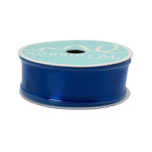 May include: A spool of shiny, royal blue ribbon. The ribbon is wrapped around a cardboard core with a light blue and white label. The label reads "R.G. RIBBON". The ribbon has a glossy finish and is suitable for crafts and gift wrapping.