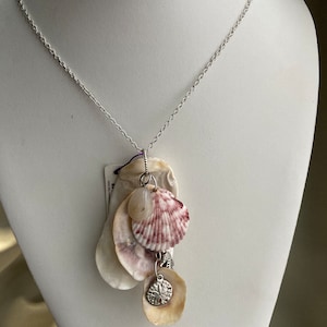 Sea shell pendant necklace, ocean shells clustered with a Quartz  bead and a sterling plated sanddollar charm