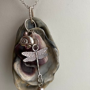 Sea shell pendant necklace, ocean shells clustered, Wampum shell with a sterling plated dragonfly and shell charm