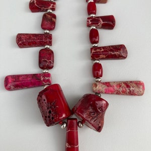 Sea sediment Jasper spike & stick set, genuine Red coral tube necklace, with sterling silver plated accents finished in a sterling clasp