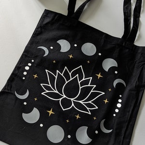 Black Tote Bag with A Mystical Lotus and Celestial Moon Phases with Gold Highlights