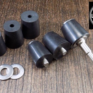May include: A set of six black rubber polishing mandrels for use with a rotary tool. The mandrels are of varying sizes and come with two metal washers.