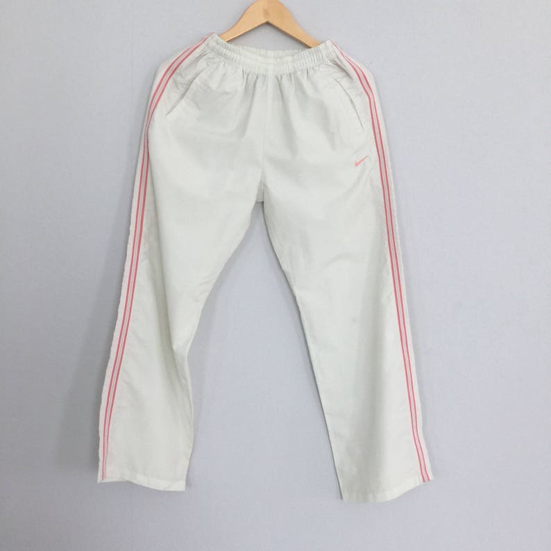 nike tracksuit pink stripe