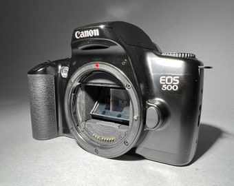 Canon EOS 500 SLR film camera body only - with FREE 35mm roll of film!