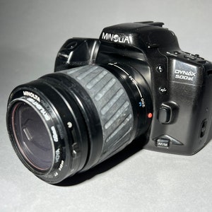 Minolta Dynax 500si 35mm vintage camera with FREE roll of film included! Also has an 80-200mm Minolta Zoom lens & Hoya Skylight (1B) filter