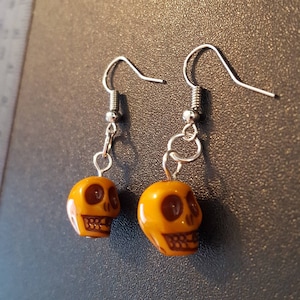 Yellow acrylic skull beaded drop dangle earrings with silver detail image 1