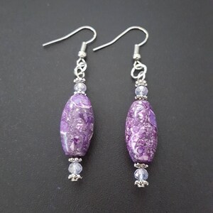 Purple and pink oval marbled glass beaded dangle earrings with silver detail