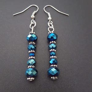 Metallic blue faceted beaded dangle earrings with silver detail