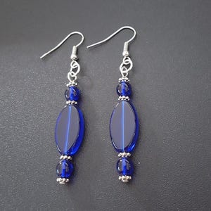 Cobalt blue elliptic glass beaded dangle earrings with silver detail