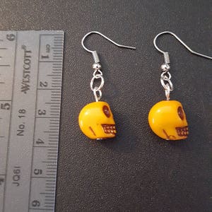 Yellow acrylic skull beaded drop dangle earrings with silver detail image 4