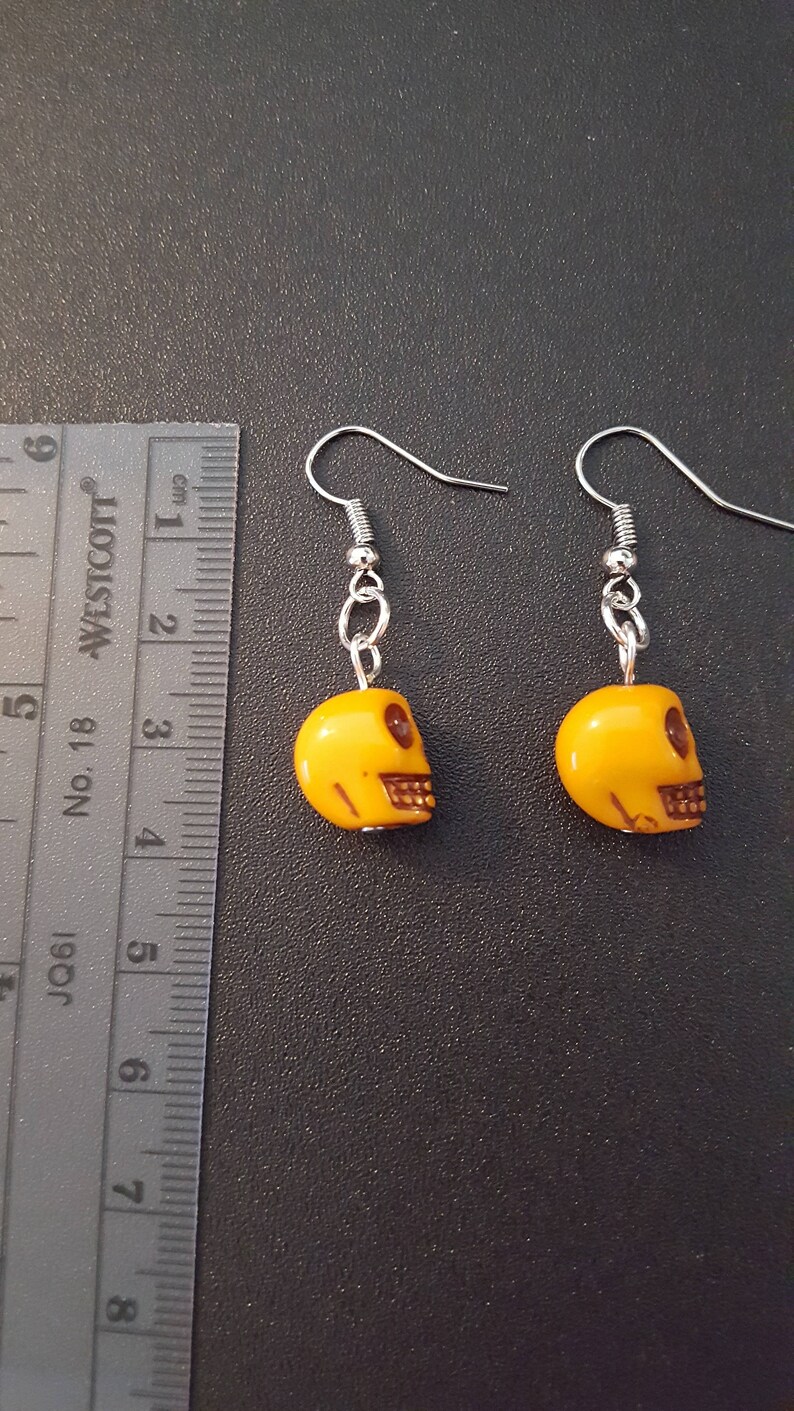 Yellow acrylic skull beaded drop dangle earrings with silver detail image 4