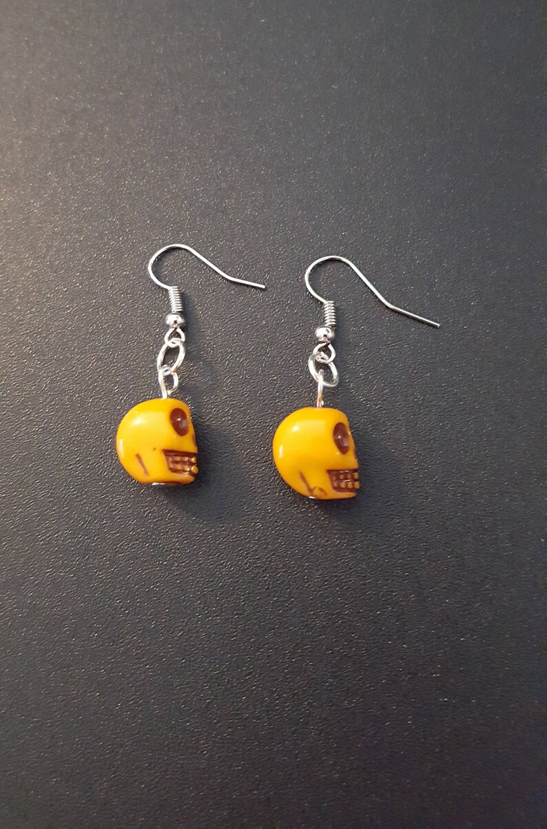 Yellow acrylic skull beaded drop dangle earrings with silver detail image 3