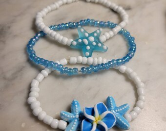 Beaded bracelets, set of three, blue and white, starfish, flowers, Beach style, stretchy, handmade, one size fits most