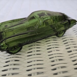 Avon vintage after shave bottle in shape of classic car. Green glass. Wild Country after shave 2 oz, some product in bottle.