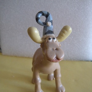 Standing Glossy Tan Moose Wearing a Winter Cap