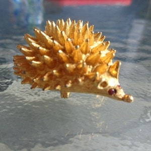 Gold Tone Hedgehog Brooch Pin with Ruby Red Rhinestone Eyes