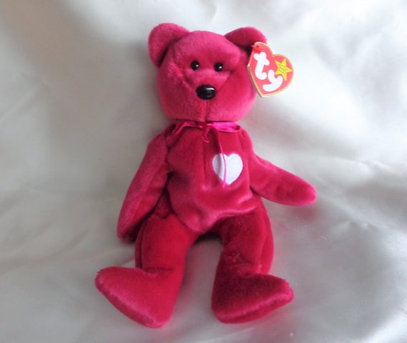 pink beanie baby bear with heart