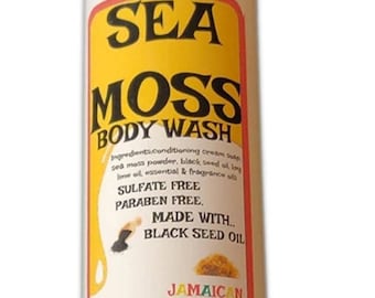 May include: A white plastic bottle of Sea Moss Body Wash with a yellow label. The label says "Sea Moss Body Wash", "Sulfate Free", "Paraben Free", "Made with Black Seed Oil", "Jamaican Sea Moss", "Key Lime Oils", and "Shea Hut". The bottle is 8 oz.