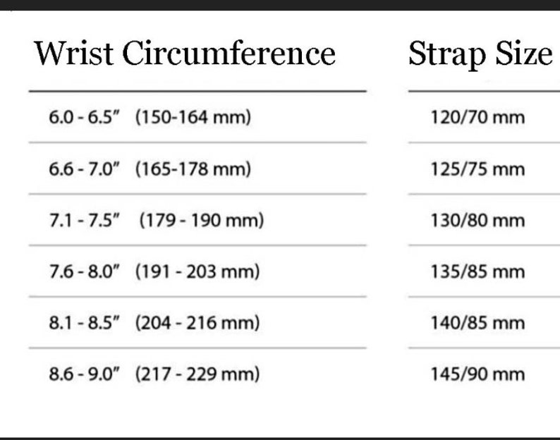 May include: A chart showing wrist circumference in inches and millimeters, and corresponding strap size in millimeters.  The chart shows six different wrist sizes, ranging from 6.0-6.5 inches to 8.6-9.0 inches.