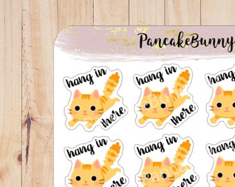 Hang er kattenstickers in