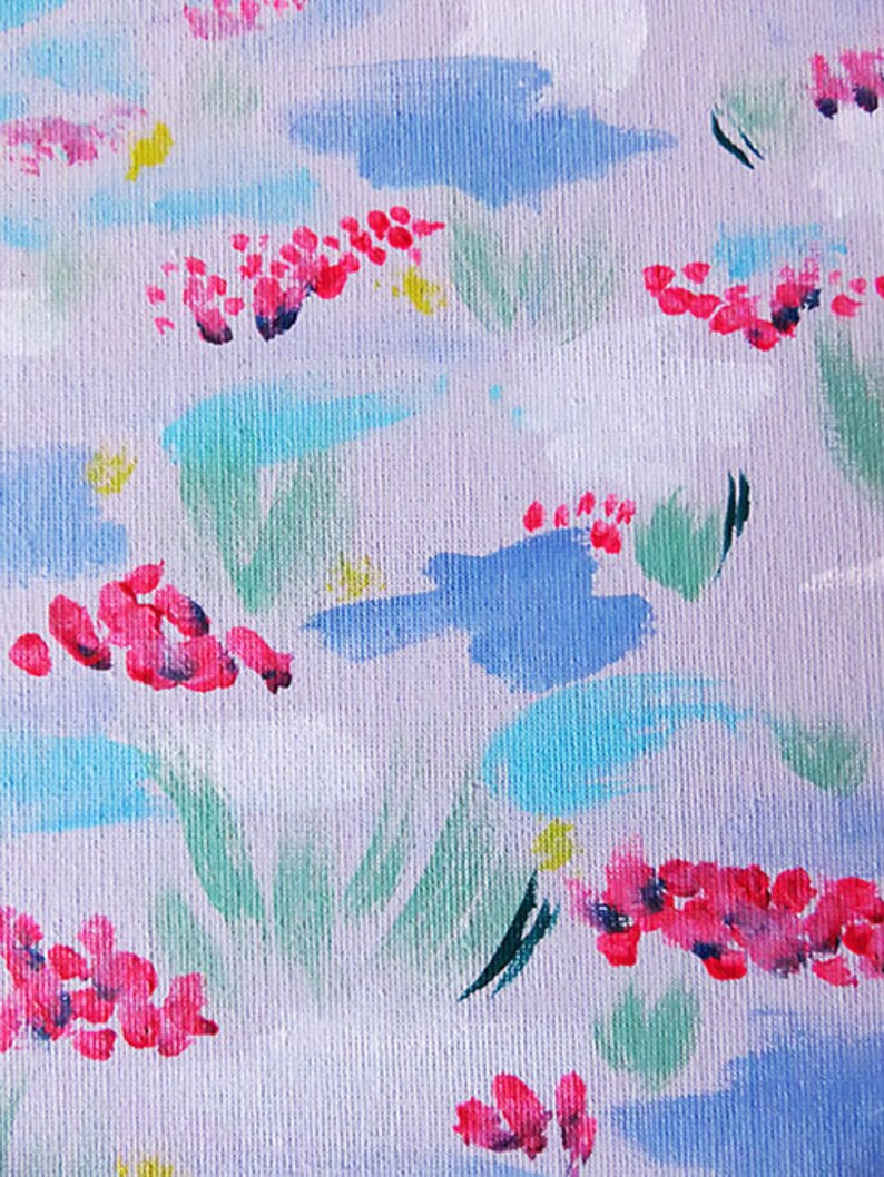 May include: Abstract painting with a white background and a variety of colours, including pink, blue, green, and yellow. The painting features a floral pattern with brushstrokes that create a textured effect.
