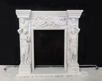 May include: White marble fireplace mantel with intricate carvings of flowers and figures. The mantel has a rectangular opening for a fireplace.