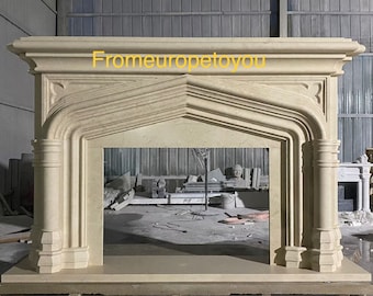 May include: A large, ornate, white marble fireplace mantel with a decorative archway. The mantel is made of stone and has a traditional design.