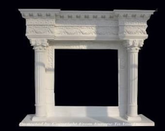 May include: White marble fireplace mantel with ornate detailing and columns. The mantel has a rectangular opening for a fireplace.