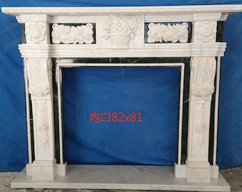 May include: White marble fireplace mantel with intricate floral carvings and a green marble surround. The opening of the fireplace is 82 inches by 81 inches.