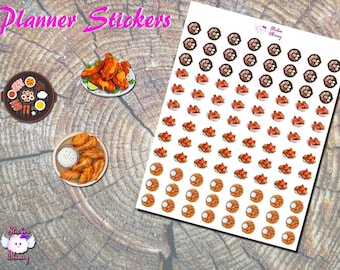 May include: Planner stickers featuring a variety of food items, including chicken wings, a platter of food, and a bowl of dip. The stickers are printed on white paper and are arranged in a grid pattern. The text "Planner Stickers" is printed at the top of the sheet.