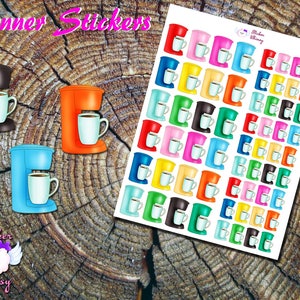 May include: A sheet of colorful coffee pot stickers with a variety of colors including red, orange, yellow, green, blue, purple, pink, and black. The stickers are designed to look like a single-serve coffee maker with a cup of coffee. The sheet of stickers is on a wooden background.