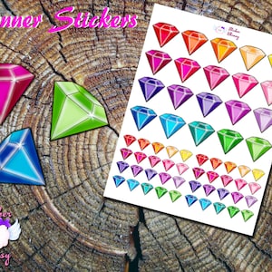 May include: A sheet of planner stickers featuring colorful diamond shapes in various sizes. The stickers are printed on white paper and are perfect for adding a touch of sparkle to your planner.