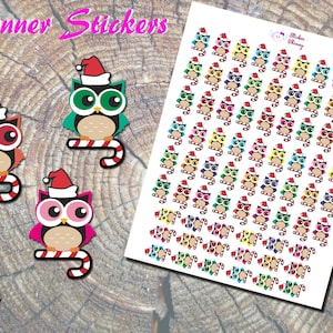 May include: A sheet of colorful Christmas owl stickers. Each owl is wearing a Santa hat and holding a candy cane. The stickers are perfect for adding a festive touch to planners, journals, and other surfaces.