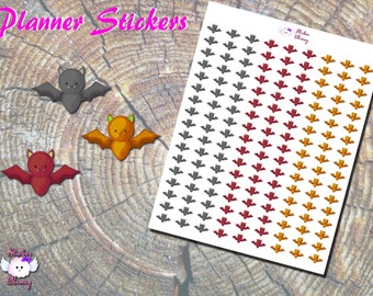 May include: A sheet of planner stickers featuring cute cartoon bats in gray, red, and orange. The sheet has the text "Planner Stickers" at the top.