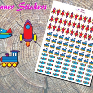 May include: A sheet of planner stickers featuring colourful illustrations of a rocket, a train, and an aeroplane. The stickers are on a white background and are ready to be used in a planner or journal.