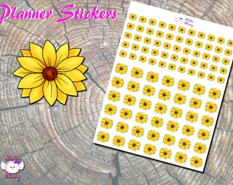 Peut inclure: Une feuille d'autocollants pour planificateur avec un motif de tournesol jaune. La feuille comprend 63 autocollants individuels, chacun avec un tournesol avec un centre brun.
